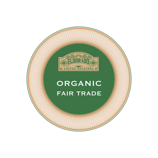 Eldorado Coffee Roasters organic and fair trade logo on a green circle with a textured border.