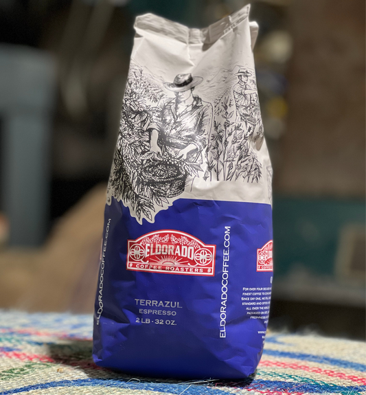 A 2lb bag of El Dorado Coffee Roasters Terrazul Espresso stands on a colorful rug.