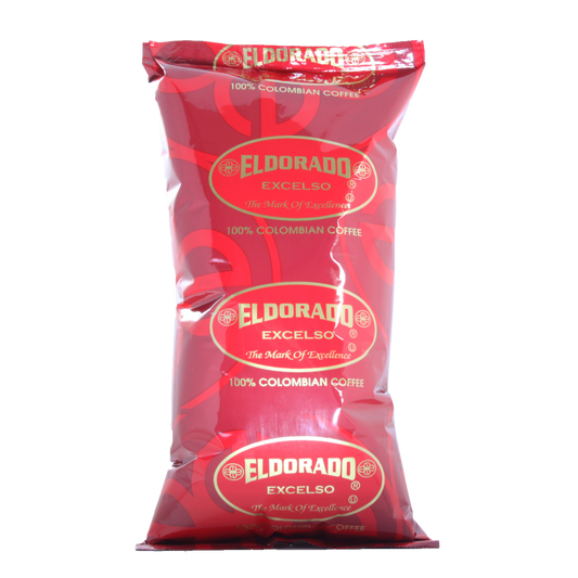 Red foil bag of Eldorado Excelso 100% Colombian coffee stands against a white background.