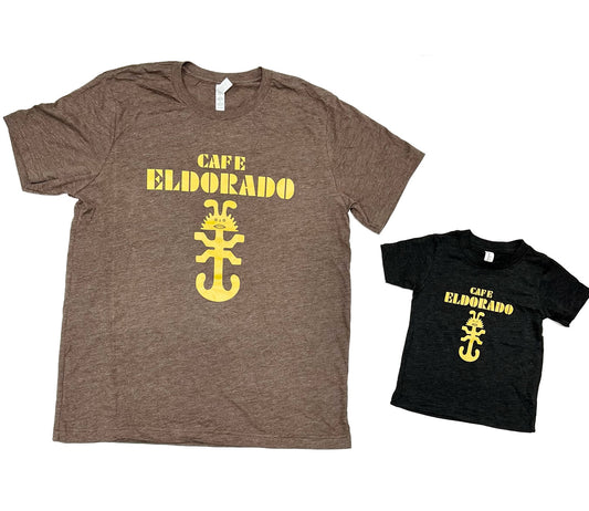 Matching adult and child heather brown and black t-shirts display the Cafe Eldorado logo, featuring a whimsical yellow lizard and bold lettering.