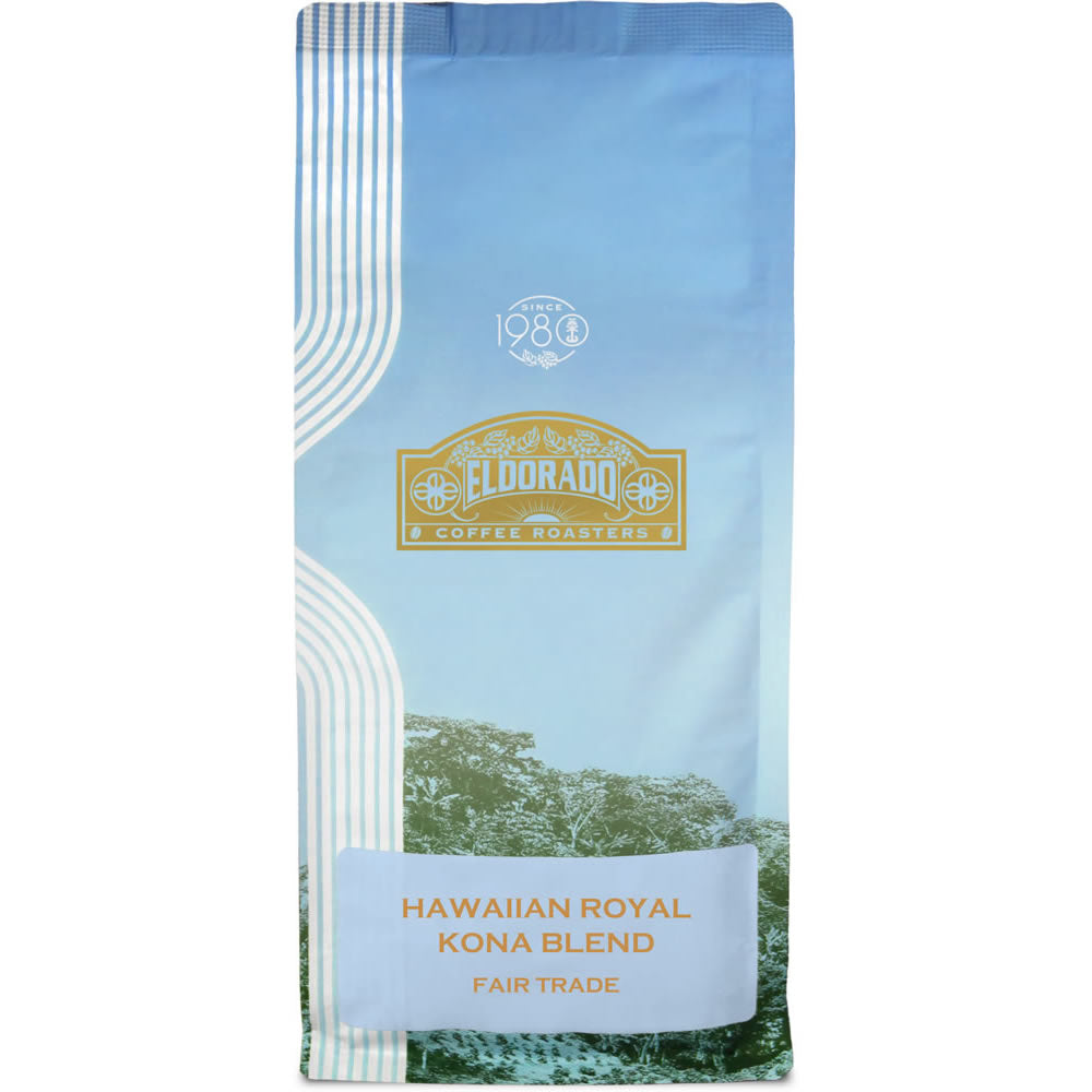 A blue bag of Fair Trade El Dorado Hawaiian Royal Kona Blend coffee beans stands against a white background. 
