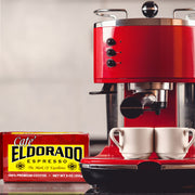 Red espresso machine brews two cups of coffee using Cafe Eldorado espresso beans. 
