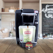 Black Keurig K-Compact single-serve coffee maker brews El Dorado Espresso into a to-go cup. 
